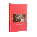 A hardcover book titled 'In Another Lifetime: A collection of poems' by Ryan Hennessy, featuring a textured coral-red cover with a central square black-and-white photograph and white script text.